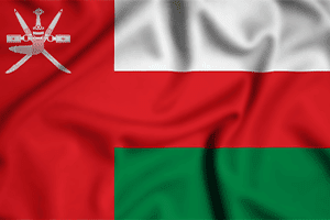 Roaming_0006_vecteezy_oman-flag-waving-in-the-wind-background-illustration-silk_51070081